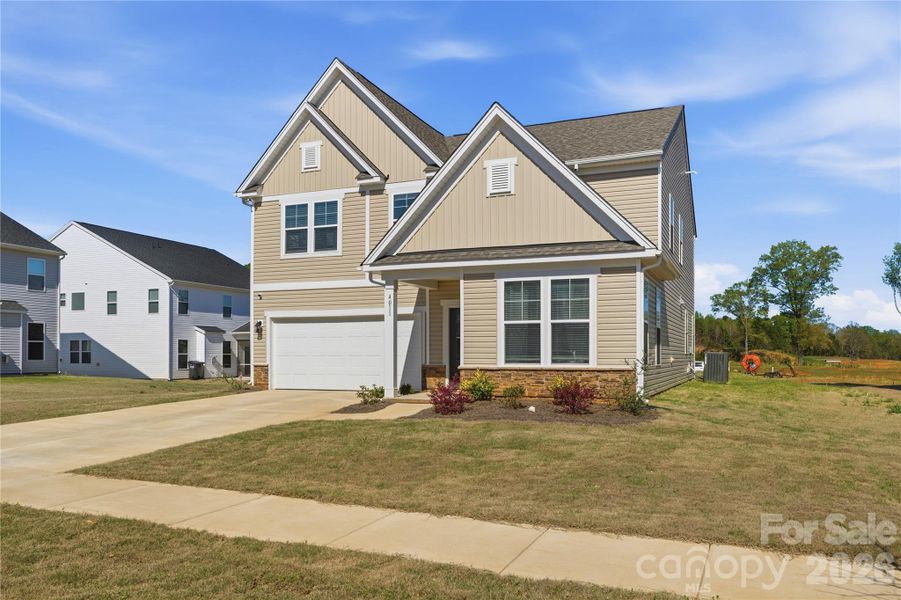 Front exterior of a new home in Clairmont, Charlotte, NC, highlighting curb appeal (Image 22).