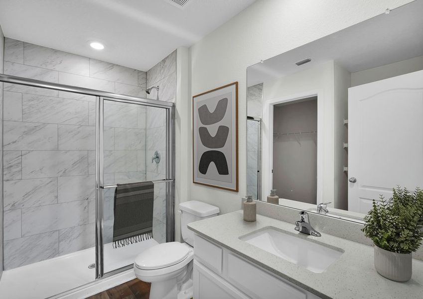 Get ready for your day in the spacious master bathroom