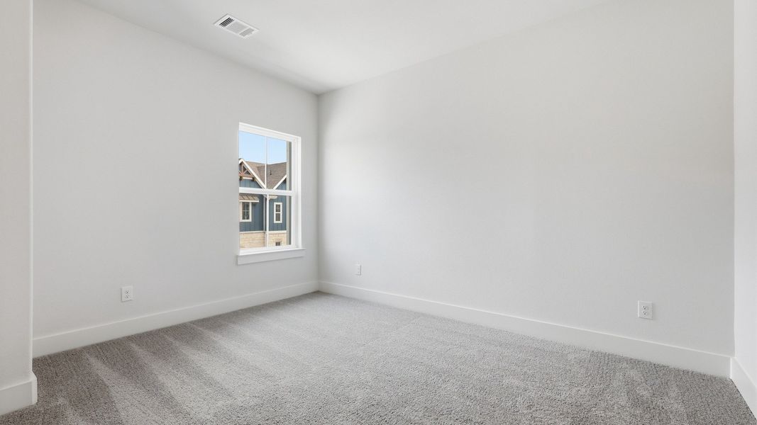 Furnished interior view inside a new home in Collin Creek, Plano (Image 34).