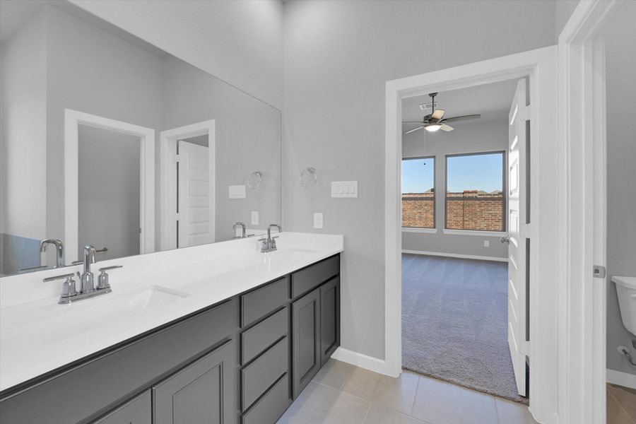 Furnished interior view inside a new home in Sunterra 40, Katy (Image 12).