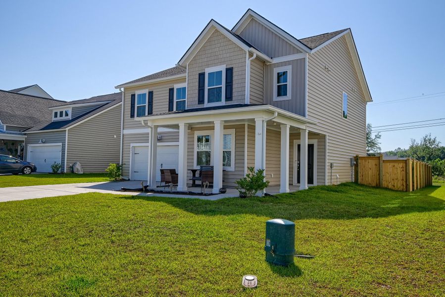 Front exterior of a new home in Heron's Walk at Summers Corner, Summerville, SC, highlighting curb appeal (Image 25).