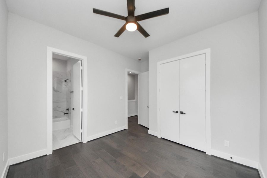 Secondary bedroom showcasing private ensuite bath