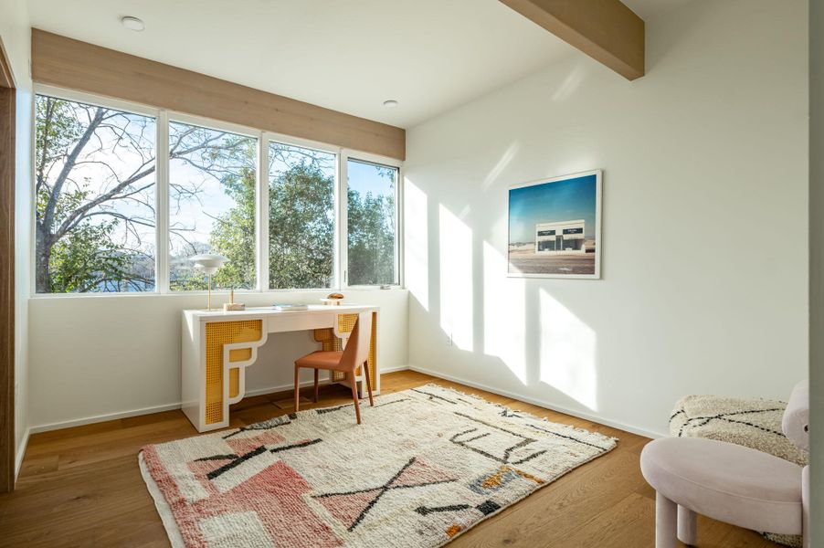 Office featuring wood finished floors and beam ceiling