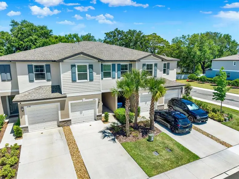 Front exterior of a new home in , Land O' Lakes, FL, highlighting curb appeal (Image 2). Front exterior of a new home in , Land O' Lakes, FL, highlighting curb appeal (Image 2).