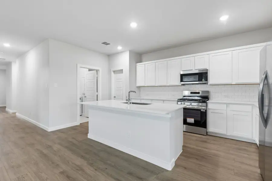 Kitchen in the Oscar home plan by Trophy Signature Homes – REPRESENTATIVE PHOTO Kitchen in the Oscar home plan by Trophy Signature Homes – REPRESENTATIVE PHOTO
