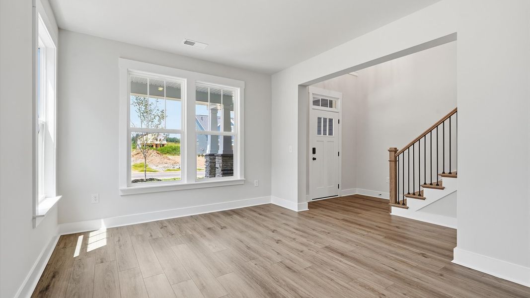 Elegant dining room opens to a functional floor plan with tasteful upgrades throughout at the Harrier Point community Elegant dining room opens to a functional floor plan with tasteful upgrades throughout at the Harrier Point community