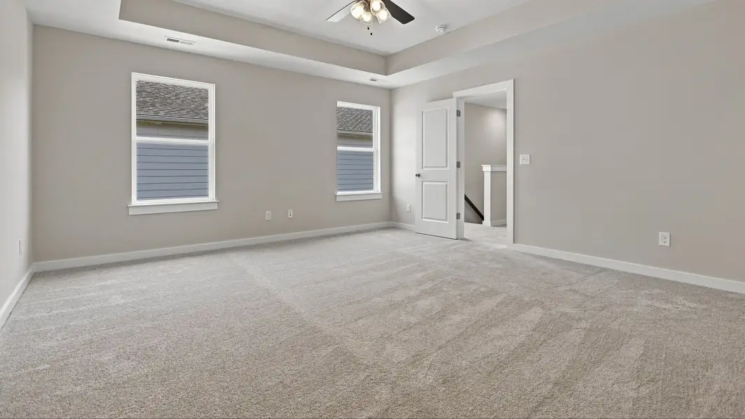 View of room entryway accompanied by natural light flooding in from windows