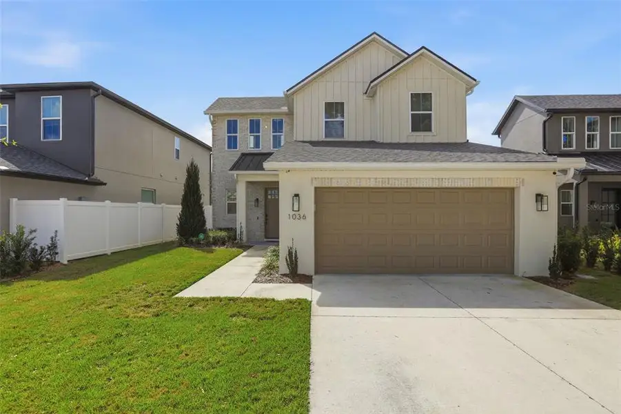 Front exterior of a new home in , Orlando, FL, highlighting curb appeal (Image 26). Front exterior of a new home in , Orlando, FL, highlighting curb appeal (Image 26).