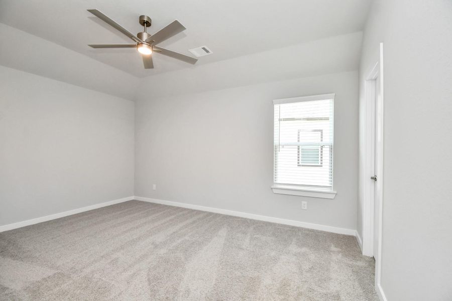 Generously sized secondary bedrooms featuring spacious closets, soft and inviting carpeting underfoot, large windows allowing plenty of natural light, and the added touch of privacy blinds for your personal retreat. Sample photo of completed home with similar floor plan. Actual colors and selections may vary.