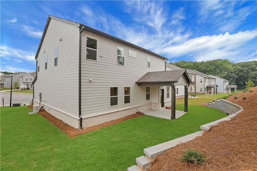 Exterior details and patio area of a home in The Paddocks at Doc Hughes, Buford (Image 28).