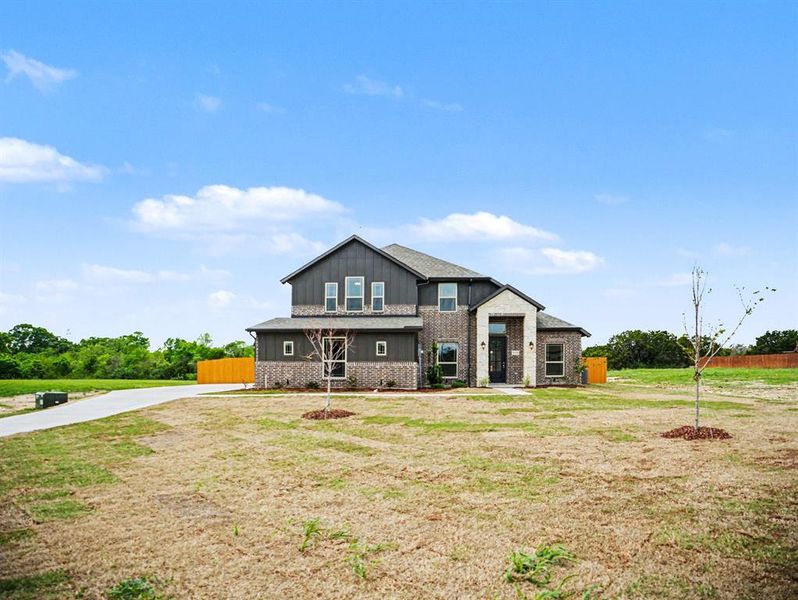 Front exterior of a new home in Ten Mile Creek Estates, DeSoto, TX, highlighting curb appeal (Image 16). Front exterior of a new home in Ten Mile Creek Estates, DeSoto, TX, highlighting curb appeal (Image 16).