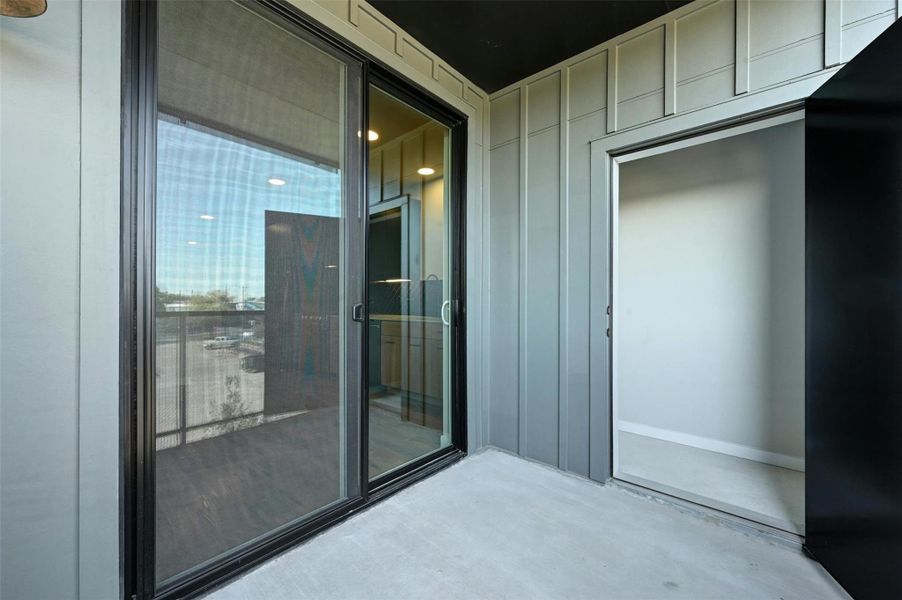 The balcony offers plenty of space for seating and a sizable storage closet.