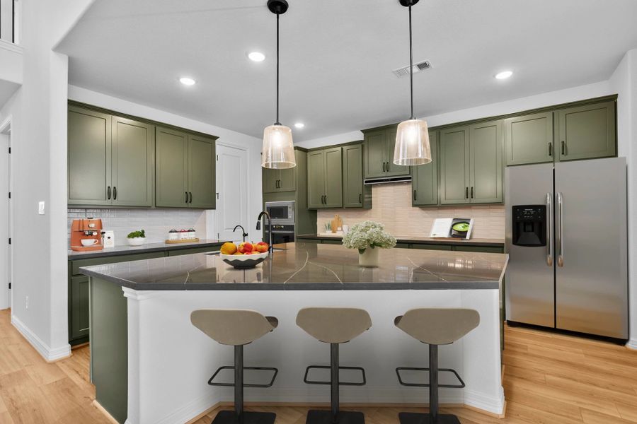 Design-forward kitchen with the AW Collection Rosemary, blending dramatic color and natural, neutral tones.