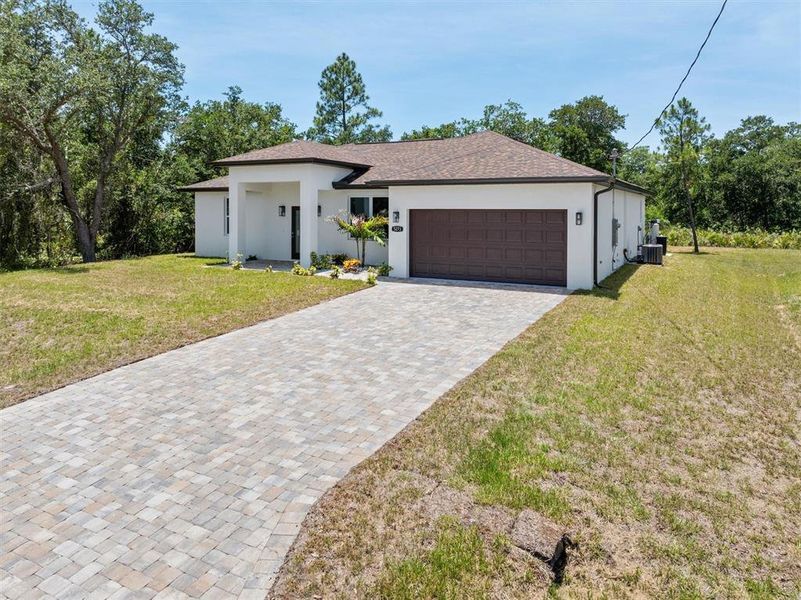 Front exterior of a new home in , North Port, FL, highlighting curb appeal (Image 20). Front exterior of a new home in , North Port, FL, highlighting curb appeal (Image 20).