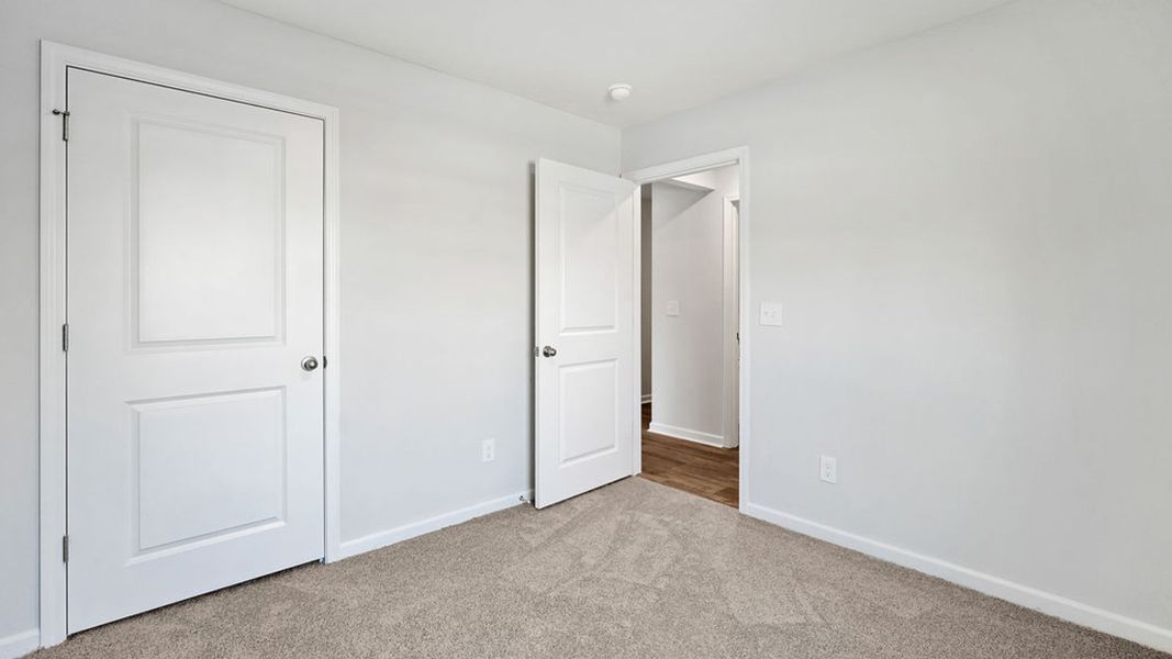 Representative unfurnished interior of a home built from the BAYSHORE by D.R. Horton in Indigo Preserve Townhomes, Leland (Image 30).