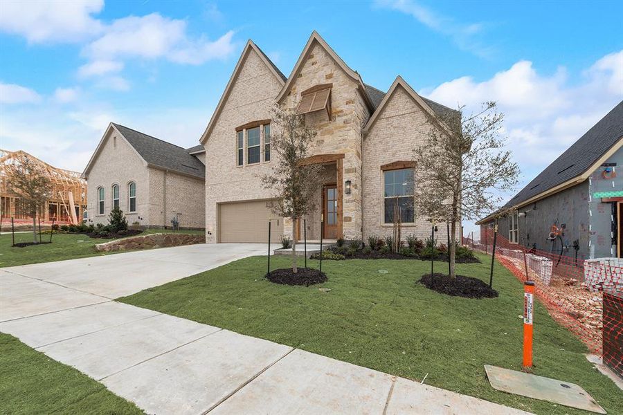 Front exterior of a new home in Hillside Village, Celina, TX, highlighting curb appeal (Image 23).