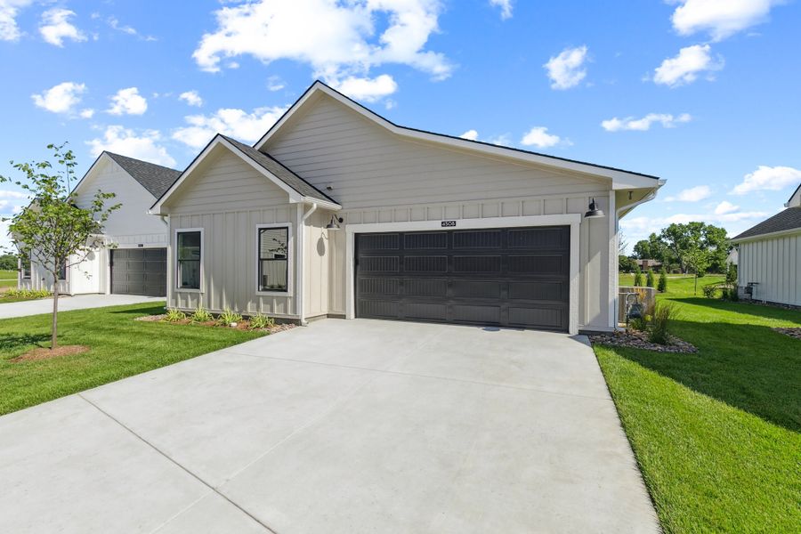 Front exterior of a new home in The Courtyards at The Moorings, Wichita, KS, highlighting curb appeal (Image 2). Front exterior of a new home in The Courtyards at The Moorings, Wichita, KS, highlighting curb appeal (Image 2).