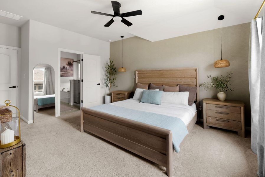 Bedroom featuring light colored carpet and ceiling fan
