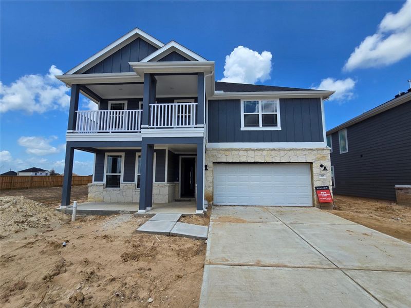 As you step closer, the front porch beckons, offering a cozy spot to relax with a morning coffee or wave to neighbors as they stroll by.