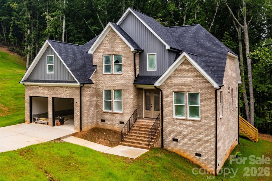 Front exterior of a new home in , Dallas, NC, highlighting curb appeal (Image 25).