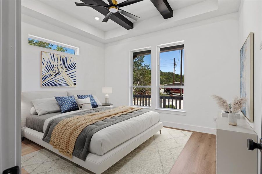 Bedroom with ceiling fan and light wood-type flooring