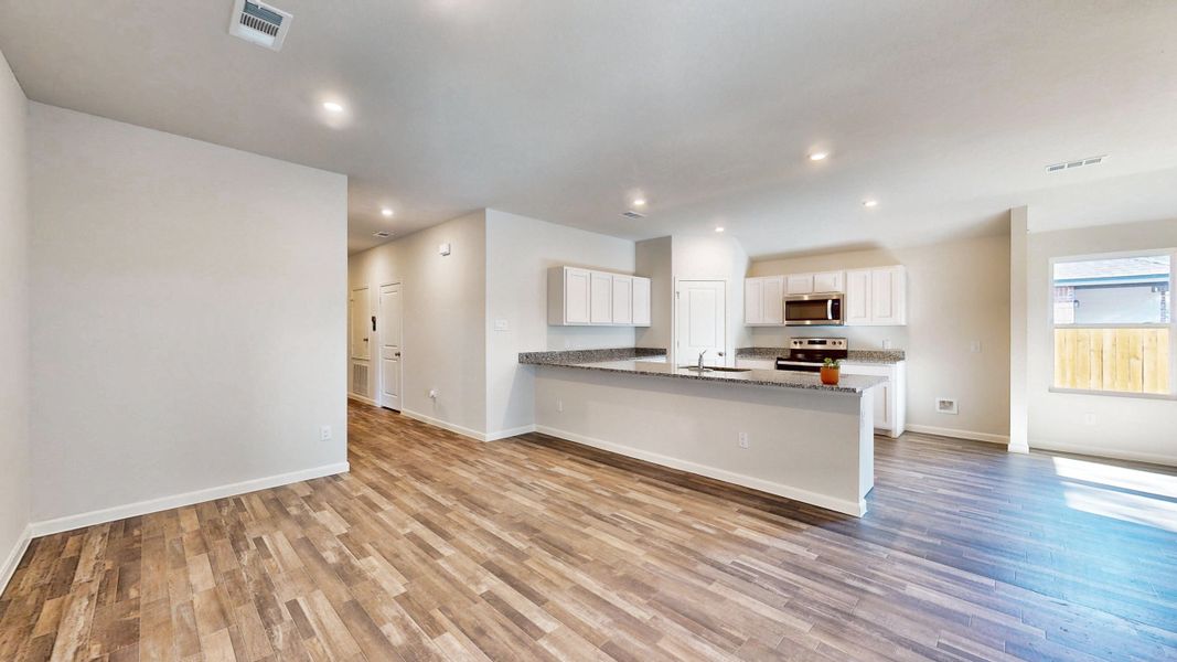 A kitchen with white cabinets. A kitchen with white cabinets.