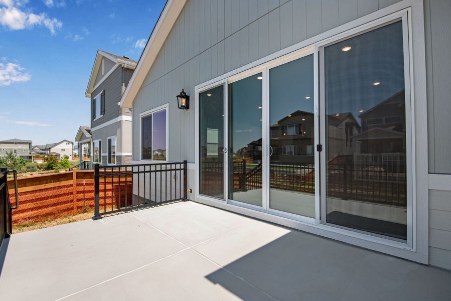 Exterior details and patio area of a home in Reunion, Commerce City (Image 23).
