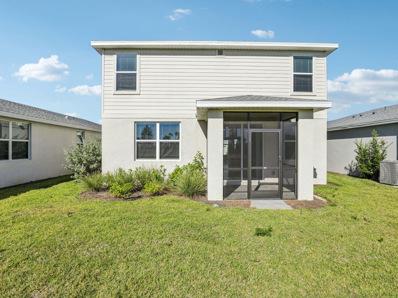 Exterior details and patio area of a home in Crescent Lakes - Premier Series, Punta Gorda (Image 16).