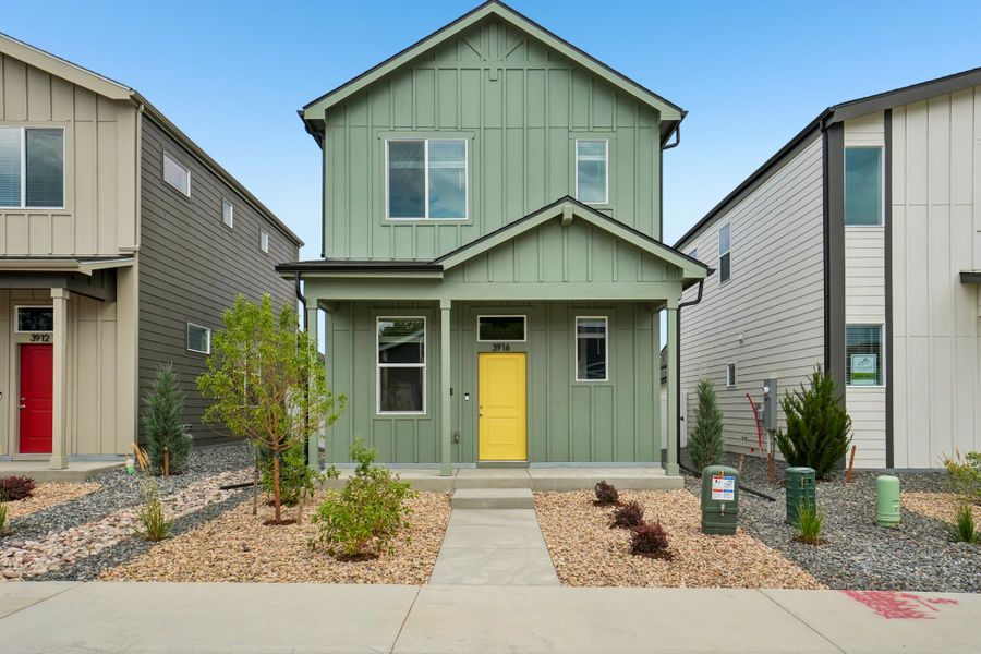 Front exterior of a new home in Liberty Draw, Evans, CO, highlighting curb appeal (Image 21).
