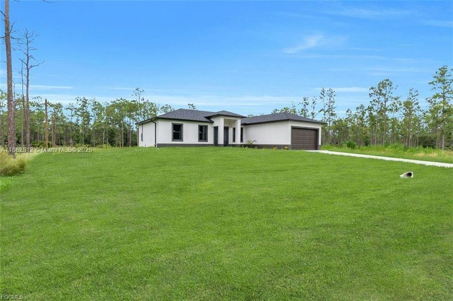 Front exterior of a new home in , Lehigh Acres, FL, highlighting curb appeal (Image 19).
