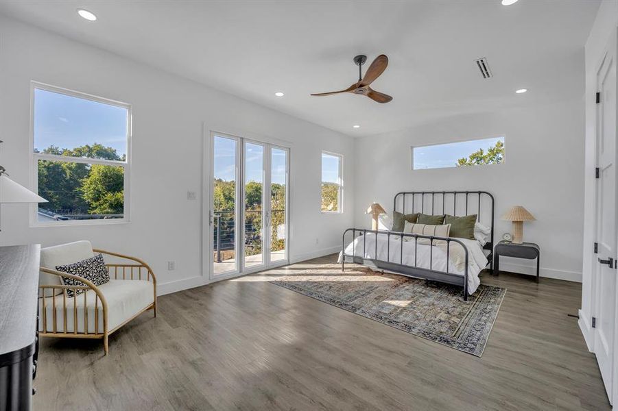 Bedroom featuring access to outside, ceiling fan, and wood-type flooring