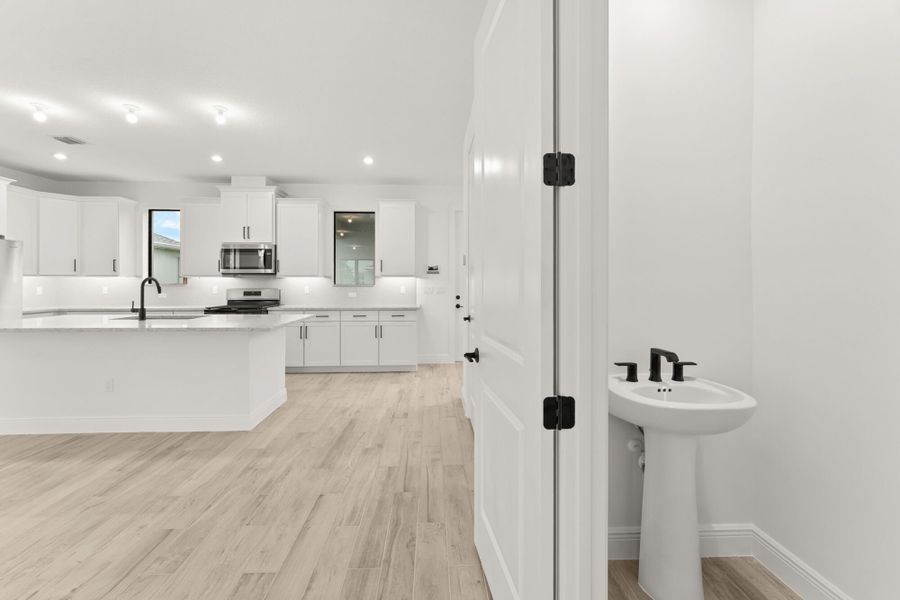 Furnished interior view inside a new home in Newfield - Rosette Park, Palm City (Image 5).