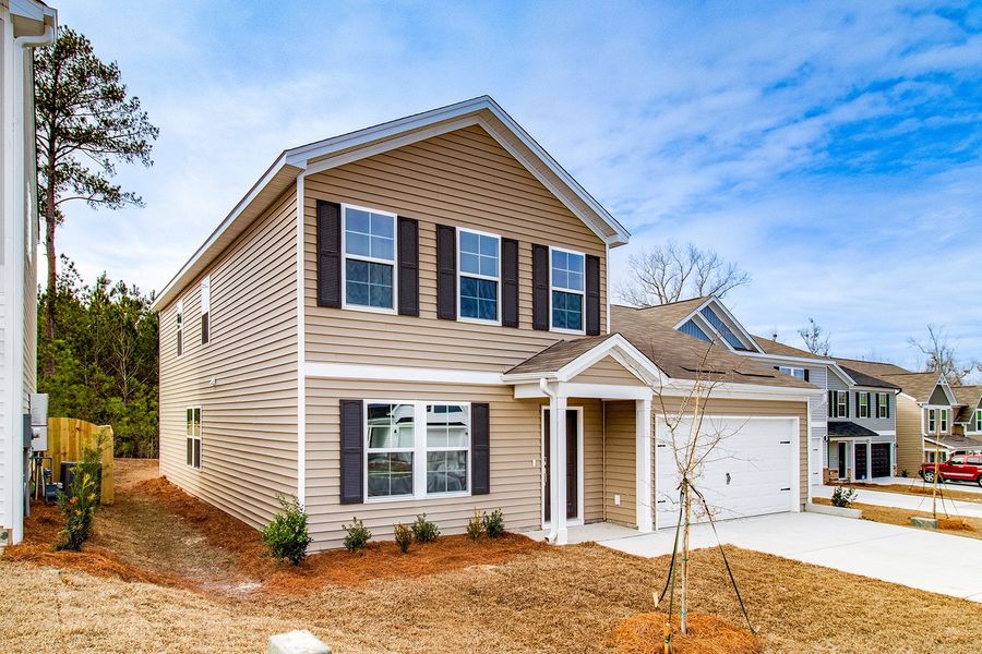 Front exterior of a new home in Ellington, Elgin, SC, highlighting curb appeal (Image 20). Front exterior of a new home in Ellington, Elgin, SC, highlighting curb appeal (Image 20).