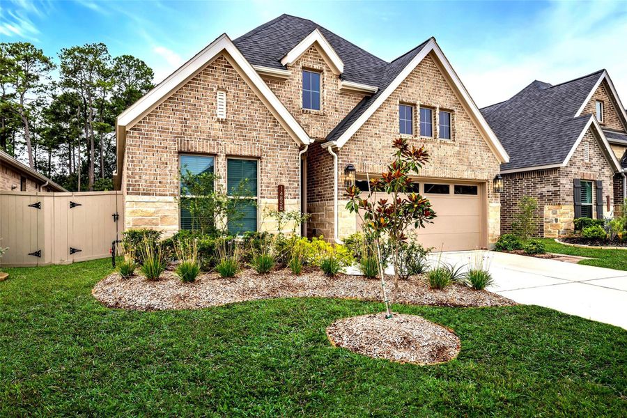 The gorgeous stone and brick façade and manicured lawn provide lovely curb appeal. The gorgeous stone and brick façade and manicured lawn provide lovely curb appeal.