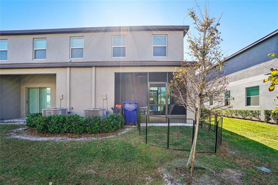 Exterior details and patio area of a home in Bryant Square: The Townes, New Port Richey (Image 4).
