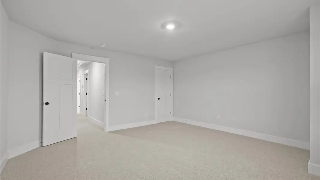 Accomplished design shines in this carpeted bedroom with a functional walk-in closet Accomplished design shines in this carpeted bedroom with a functional walk-in closet