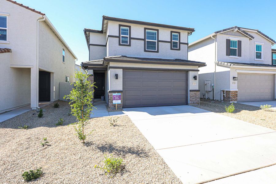 A building with garages and a driveway.