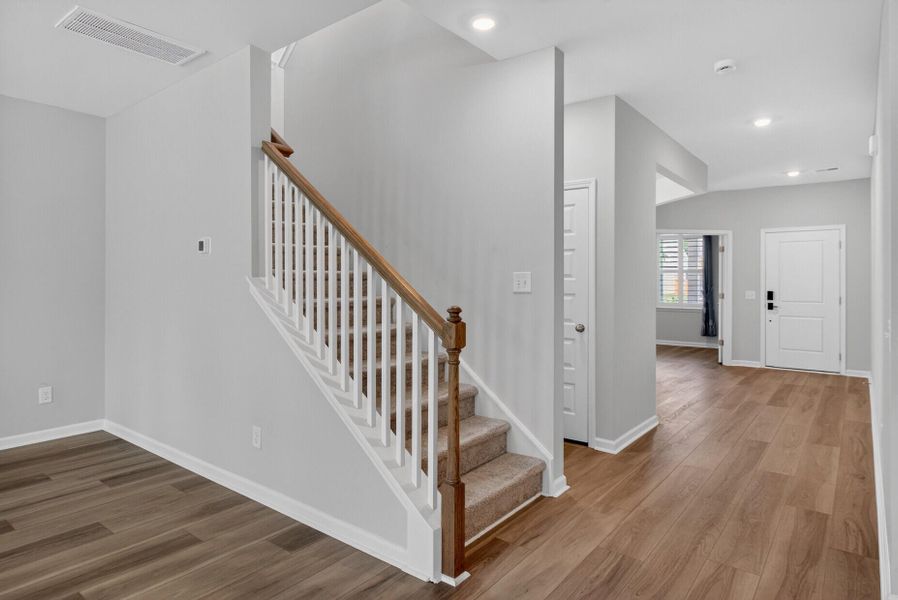 Spacious, unfurnished interior of a new home in Lindera Preserve at Cane Bay Plantation, Summerville (Image 22).