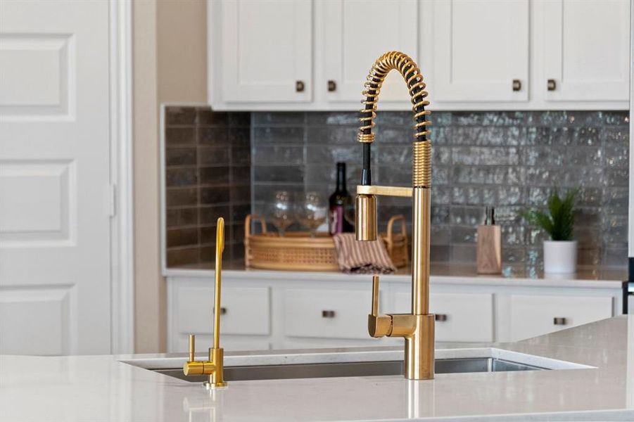 Kitchen sink features the Moen Align Spring Kitchen Faucet - MotionSense Wave One Handle Pulldown - Brushed Gold over a self-rimming single bowl kitchen sink.