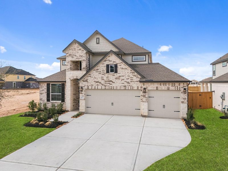 Front exterior of a new home in Sunterra Lakes, Fulshear, TX, highlighting curb appeal (Image 21).