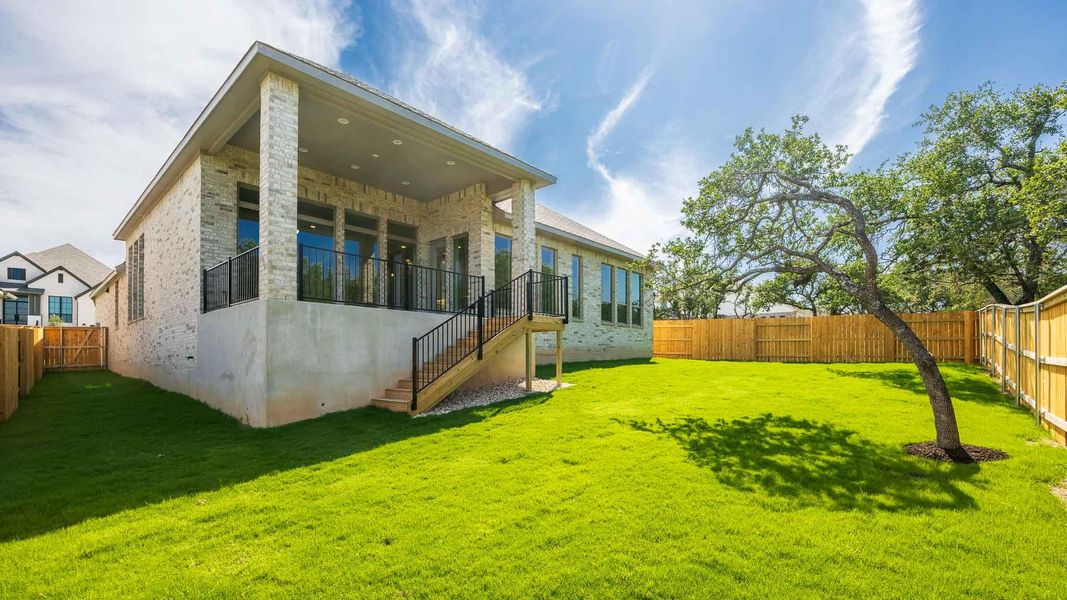 Rear view of property featuring stairs and brick siding Rear view of property featuring stairs and brick siding
