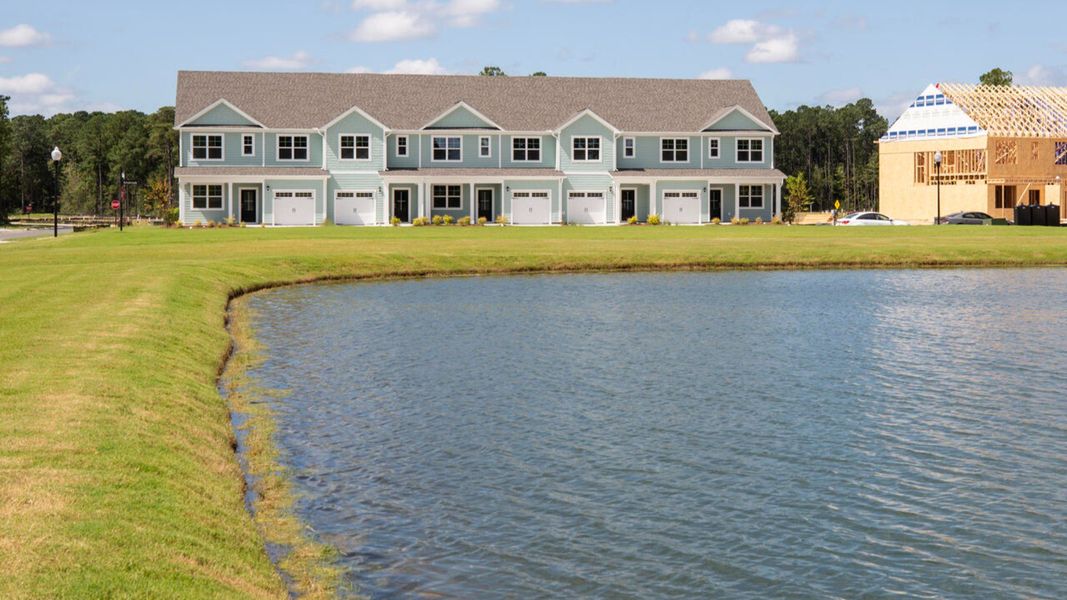 Front exterior of a new home in Indigo Preserve Townhomes, Leland, NC, highlighting curb appeal (Image 2).