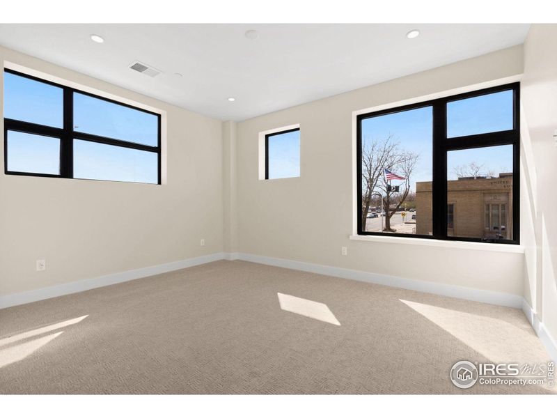 Bedroom 2 combines natural light with privacy, boasting 2 privacy windows