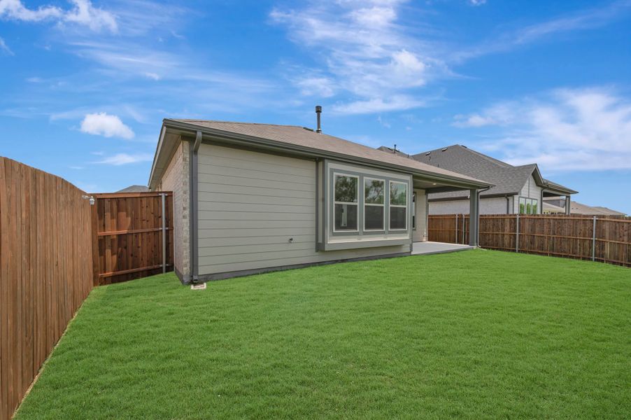 Exterior details and patio area of a home in The Meadows, Denton (Image 16).