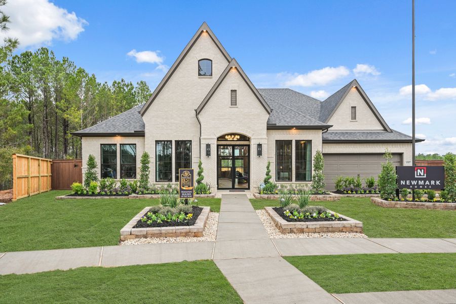 Front exterior of a new home in Wildtree 70', Montgomery, TX, highlighting curb appeal (Image 21). Front exterior of a new home in Wildtree 70', Montgomery, TX, highlighting curb appeal (Image 21).