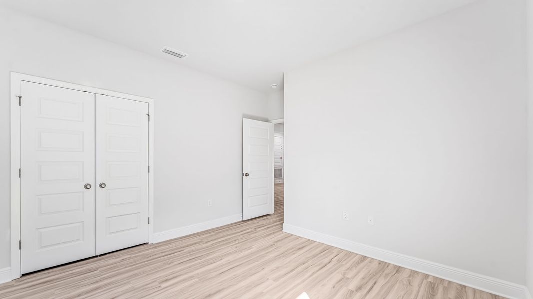 Spacious, unfurnished interior of a new home in WindMark Beach, Port Saint Joe (Image 32).