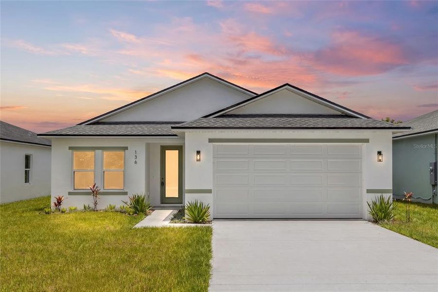 Front exterior of a new home in , Osteen, FL, highlighting curb appeal (Image 19).
