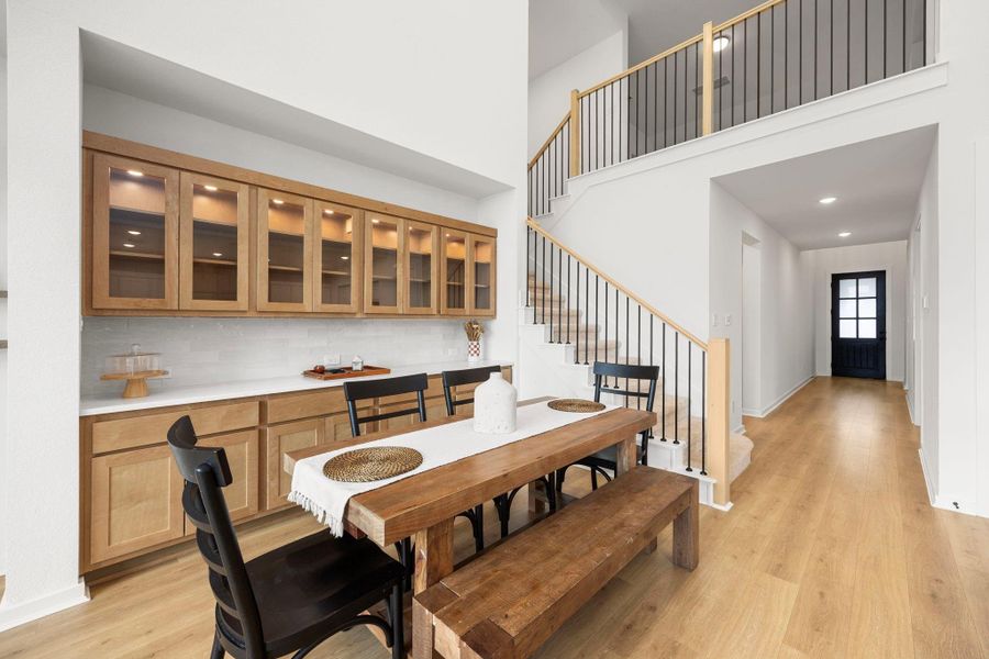 Your spacious dining area with built in cabinets and buffet bar. The lit glass cabinets are a luxurious unique feature.