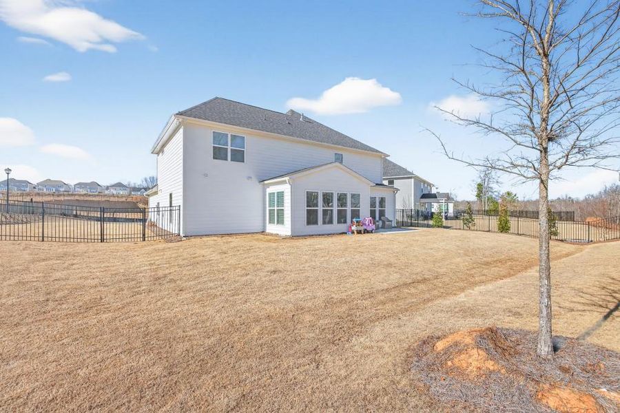 Exterior details and patio area of a home in Reunion, Flowery Branch (Image 35).