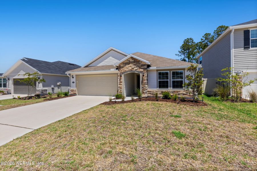 Front exterior of a new home in Copper Ridge, Jacksonville, FL, highlighting curb appeal (Image 25).